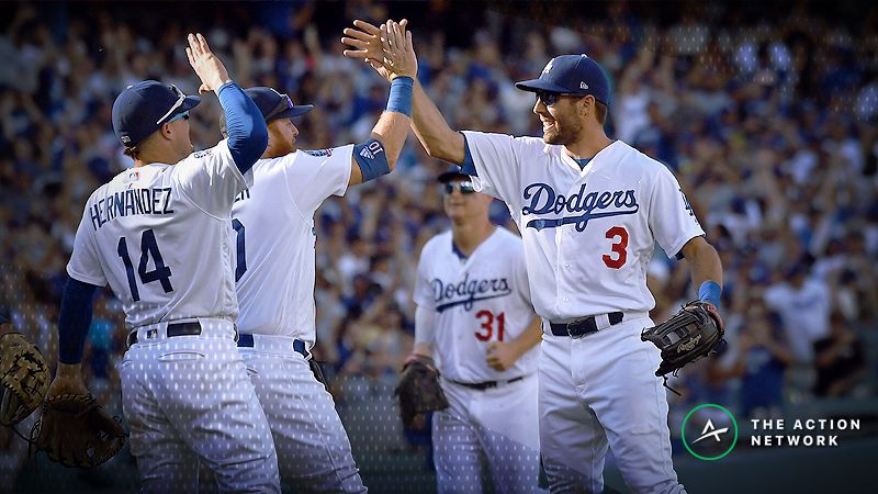 Los Angeles Dodgers center fielder Chris Taylor (3) and third baseman Justin Turner (10) celebrate the victory following the National League West division tiebreaker game at Dodger Stadium.