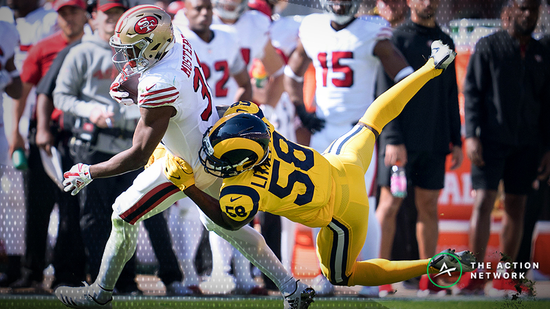 San Francisco 49ers running back Raheem Mostert (31) and Los Angeles Rams linebacker Cory Littleton (58)