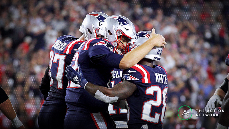 New England Patriots quarterback Tom Brady (12) and running back James White (28)